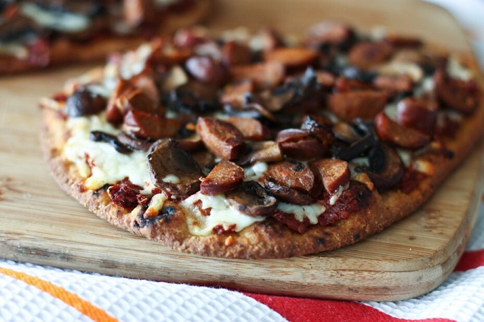 Andouille Sausage, Mushroom and Sun-Dried Tomato Naan Pizza