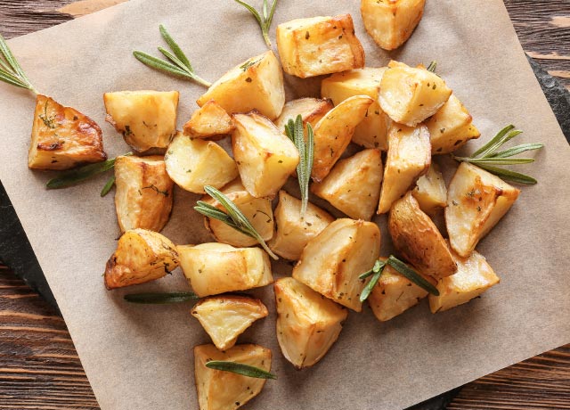 Crispy potato chunks with fresh rosemary.