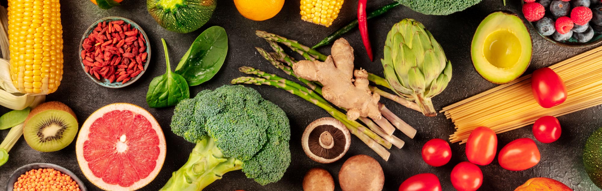 Flat lay of fresh, colorful fruits and vegetables.